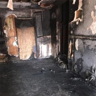 A room in a house that has been damaged by a fire in Huntington Beach.