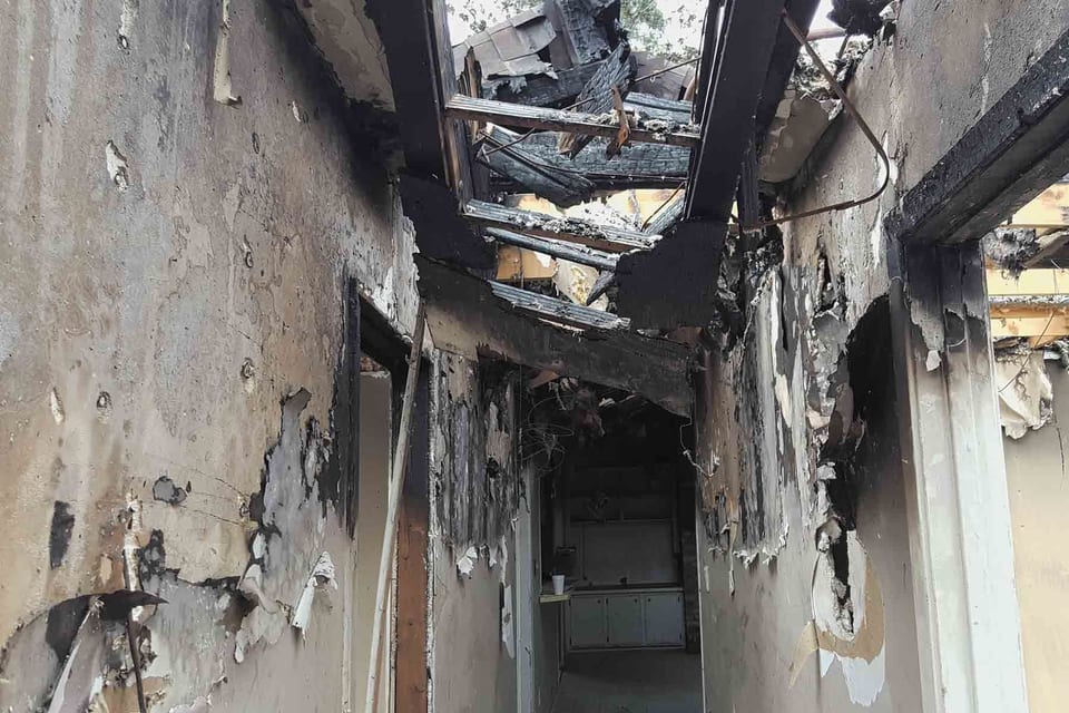 A hallway in a building that has been damaged by fire in Orange, CA.